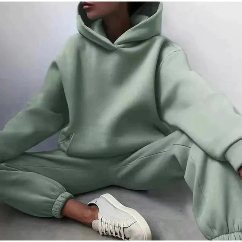 Two-Piece Tracksuit Set in mint green with matching hoodie and joggers, paired with white sneakers